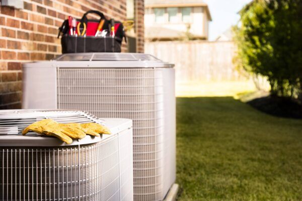 HVAC Tools on HVAC Systems Outside of Home after AC Maintenance in Washington, MO HVAC Tools on HVAC Systems Outside of Home after AC Maintenance in Washington, MO