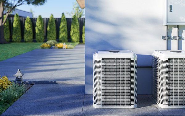 two clean and new hvac units in yard